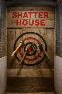 A wooden axe-throwing target at Shatter House with three axes embedded in the bullseye.